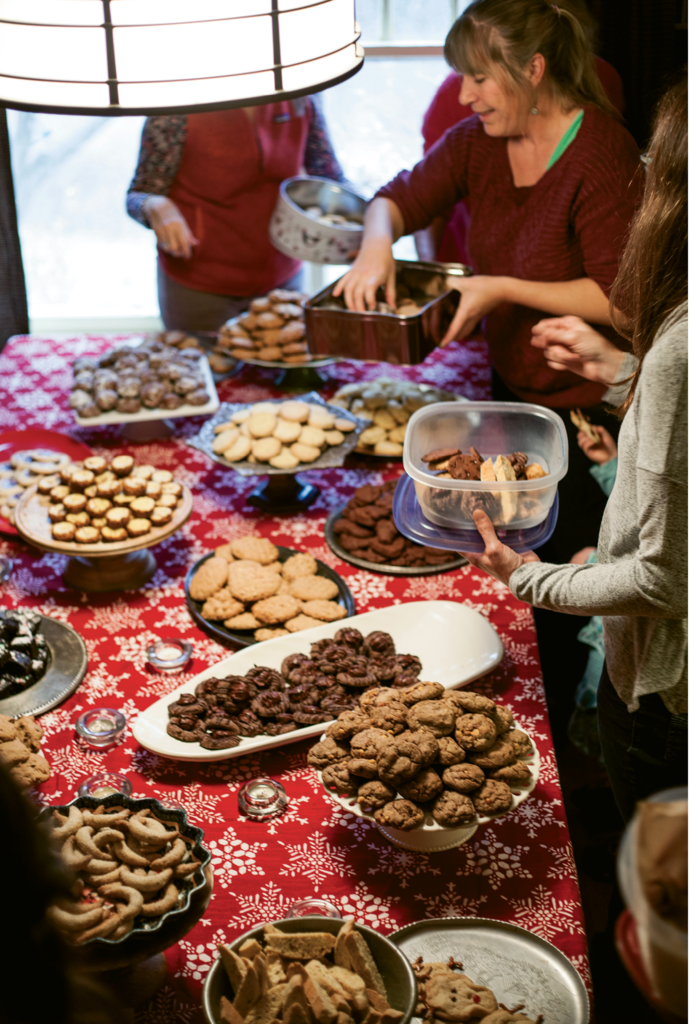 A Joyful Table: English lays out platters and cake stands for guests to display their cookies, so the spread looks as good as it tastes. When the party ends, guests are invited to take home several of each treat to enjoy and share throughout the holidays.