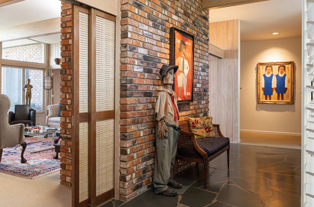 Simple But Significant - King incorporated some of his signature elements such as Japanese-inspired sliding rattan screens and slate floors into the foyer.