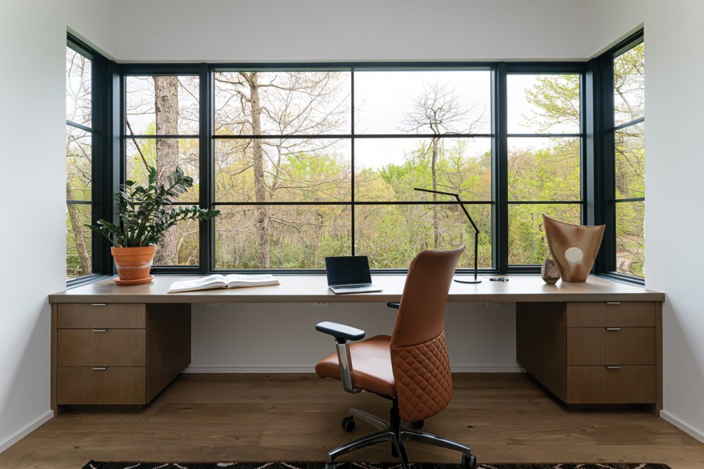 The upstairs living space has a double-sided fireplace that is wood-burning outside and gas-powered inside.