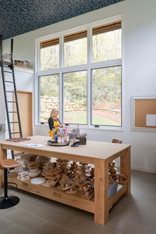 Tricia’s in-home studio is filled with natural light thanks to the extra-tall windows and high ceilings.