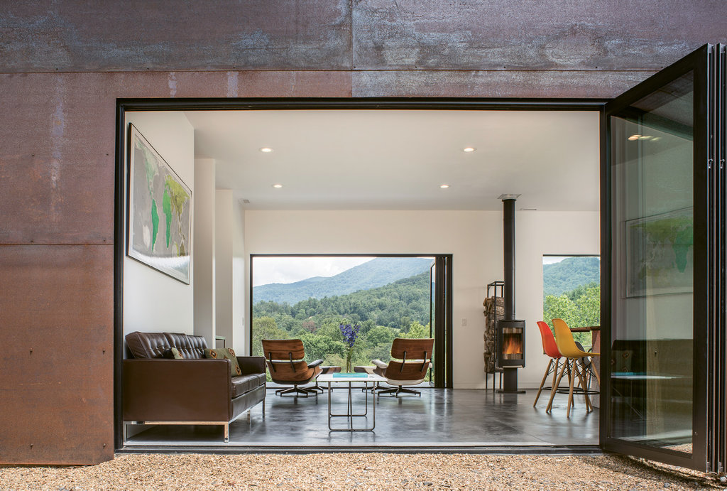 Scene Setters: Large accordion doors—the couples’ biggest splurge on the project—open the entire space to the spectacular mountain surroundings.