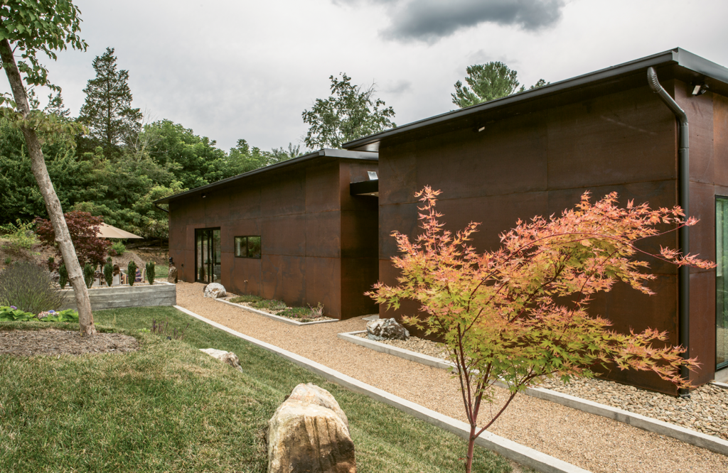 The corten steel siding will weather to a color that matches the earth.