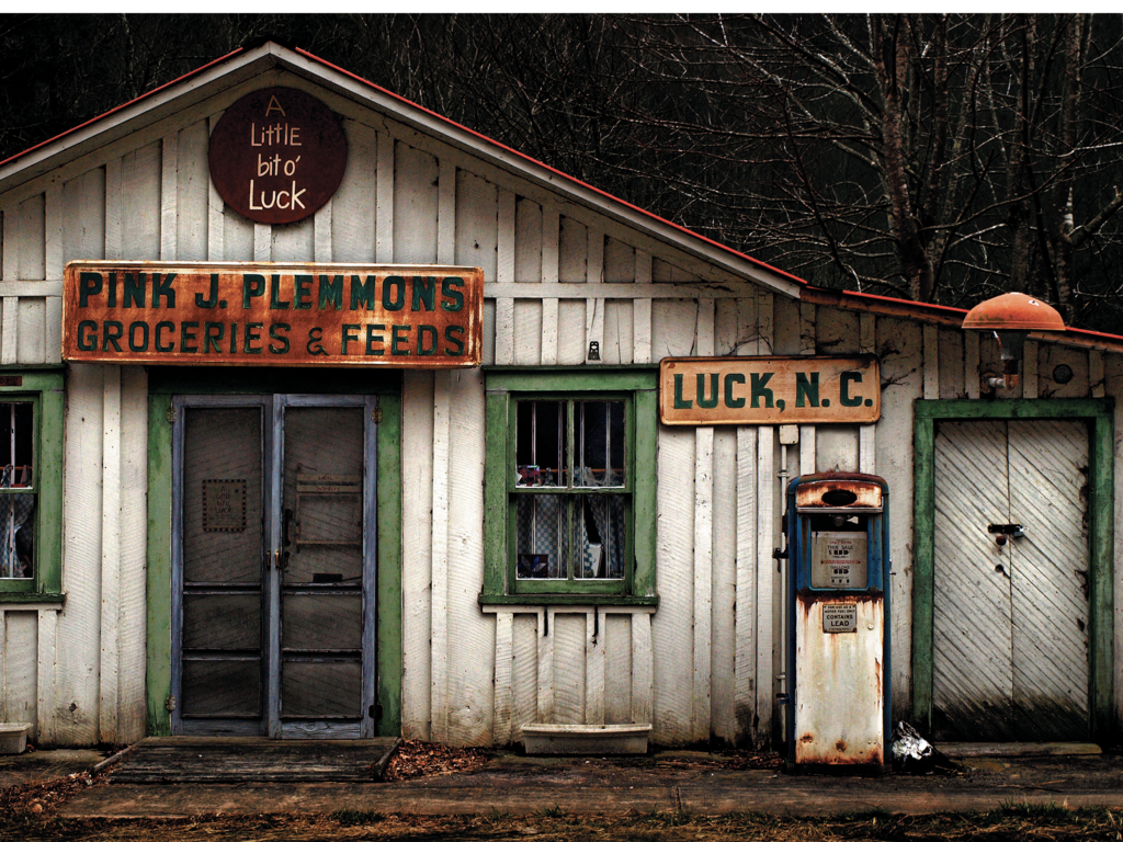 FINALIST - A LITTLE BIT OF LUCK  - J.K. York -  The bygone Pink J. Plemmons Groceries &amp; Feeds store in the tiny town of Luck had just the right character to motivate this shot.  Amateur category