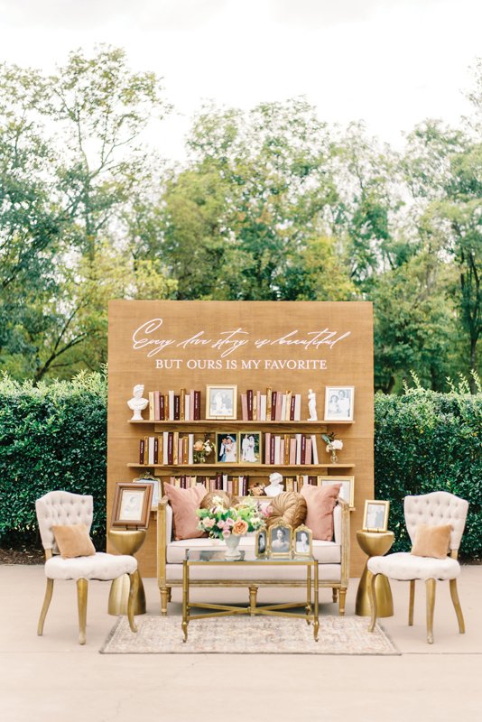 The DIY literary display doubled as the escort card wall, complete with handmade books denoting seating.