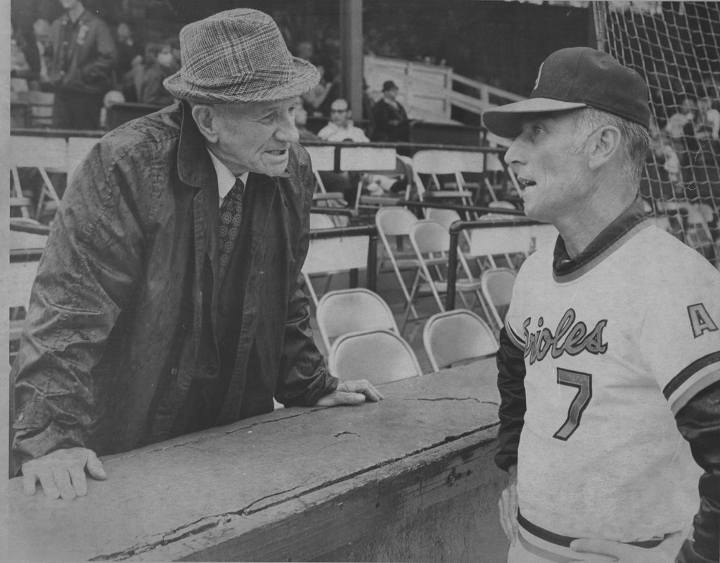 “Struttin’ Bud” Shaney (left) chats with Asheville skipper Cal Ripken Sr. Shaney pitched for Asheville on several occasions, beginning in 1928 when he had a 23-11 record. He later served as the McCormick Field groundskeeper in the 1950s and 1960s.