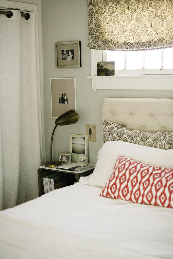She crafted the tufted linen headboard to complement the soothing tones in the master bedroom