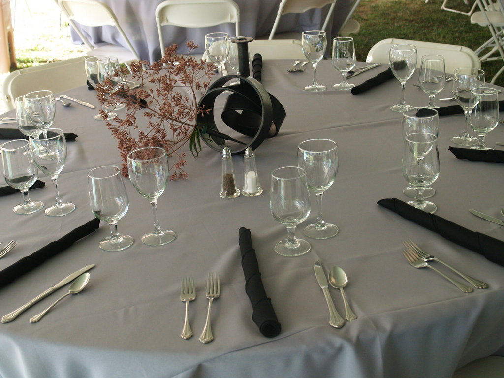 The tables are set with elegant centerpieces by Hoss Haley