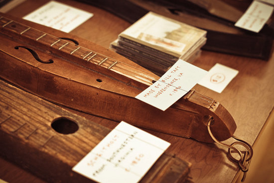 Handcrafted antique dulcimers on display in the History Center, including one made in 1890.