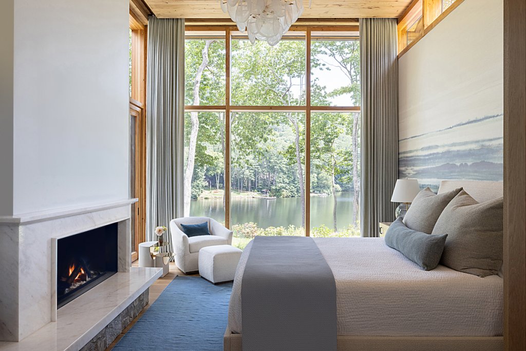 The master bedroom’s fireplace is surrounded with Carrerra gold marble for a luxurious finish.