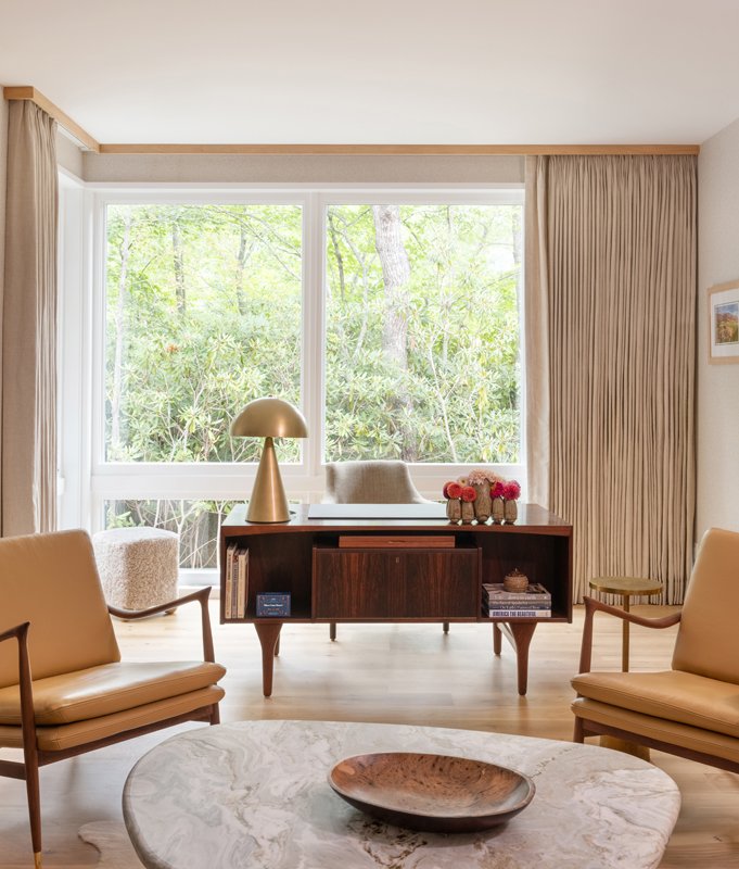 The home office features neutral pieces that tie the decor together.