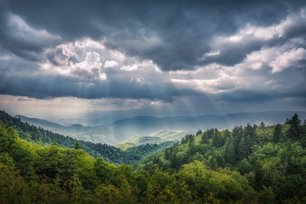 Radiance - Rhonda Kingen From the Blue Ridge Parkway’s Woolyback Overlook, you can spot the sun’s rays dancing across our mountain range.  {Professional} @rhondakingenphotography