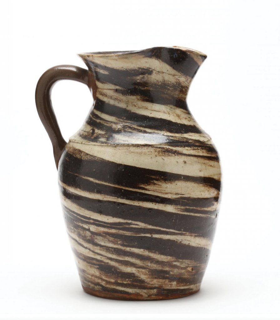 A multicolored pitcher made by Enoch Reinhardt