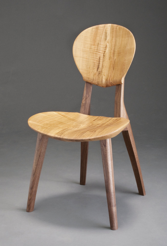 Boggs collaborated with guitarists to design the Sonus Musician&#039;s Chair (shown in ambrosia maple with walnut legs), which is ergonomically tailored to promote better posture and circulation. Photograph by Michael Traister