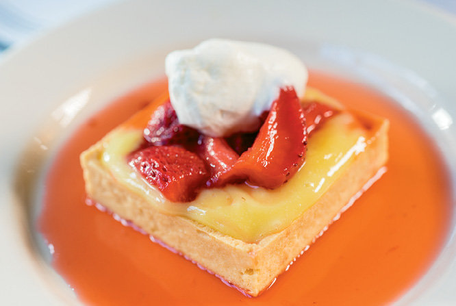 Desserts, like the house favorite lemon curd with strawberries are worth saving room for