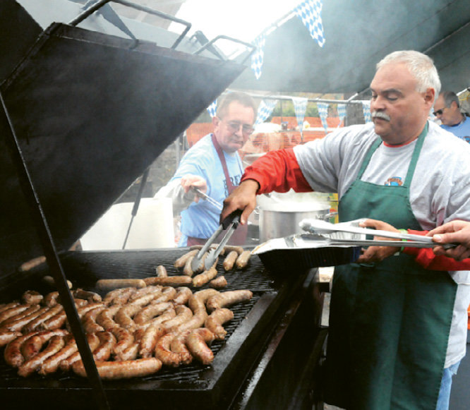Tim Wright and Chuck Brittan cooked up grilled bratwurst for the crowd.
