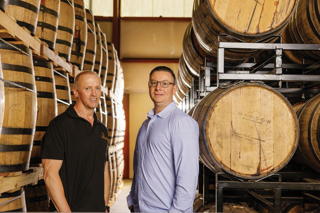 Two Trees cofounder Chad Slagle (left) and Steven Laker (right), CEO of MDWerks. Two Trees caught the attention of MDWerks because of the distillery’s unique rapid aging process that is both environmentally sustainable and true to classic flavor profiles.