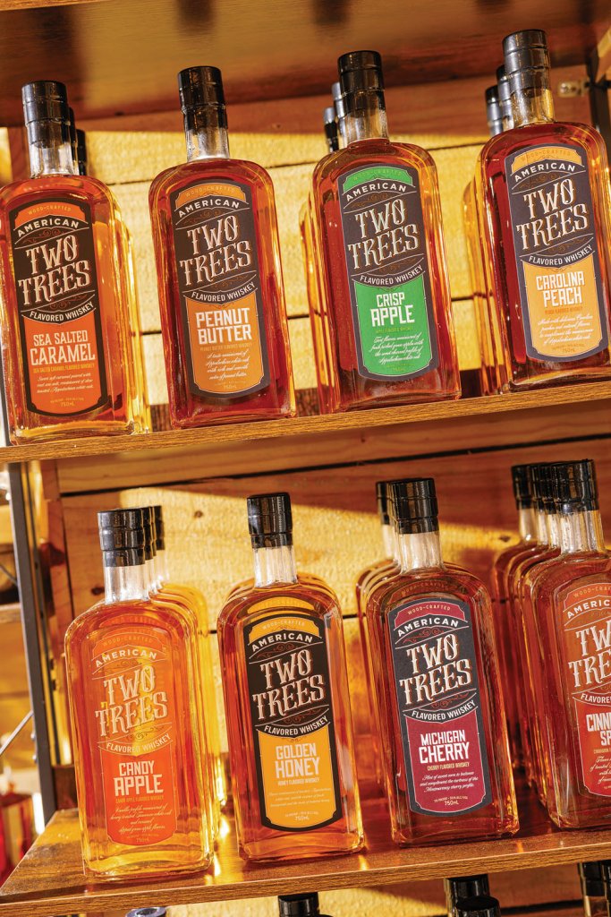 Whiskey is the main product of Two Trees Beverage Company; they offer twenty-plus varieties, including a few different bourbons and several flavored whiskeys such as Carolina peach, Michigan cherry, and peppermint. Two Trees pays homage to the mythical creatures of the Appalachians—the Snarly Yow, the Owl Head, the Wampus Cat, and the Old Fyre Dragaman—in their Folklore collection. Alongside whiskey, the distillers also offer an 80 proof premium vodka.