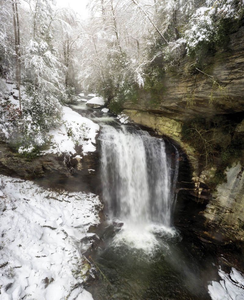Cool Rush - Located along US 276 near Brevard, Looking Glass Falls is one of WNC’s most visited cascades. Moors captured the 60-foot gusher after a snowstorm using a drone.