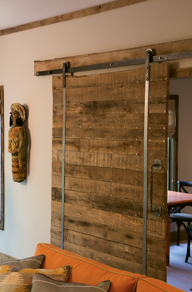 About 1,500 linear feet of wood from the old WNC Livestock Market was used on the trim, sliding door, and mantel in the living room.