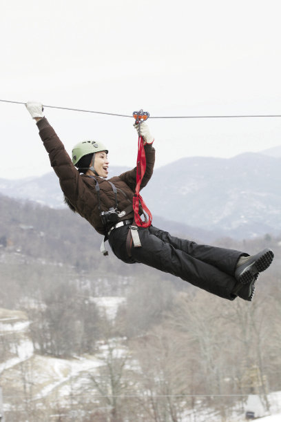 high-wire act Ziplining is now part of Hawksnest Resort’s winter fun repertoire.