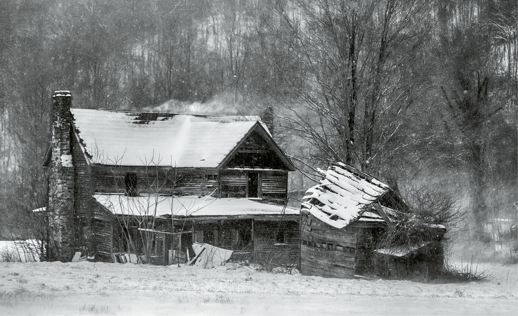 John Haldane, An old, abandoned home along N.C. 197 is lashed by a March snowstorm. Professional category