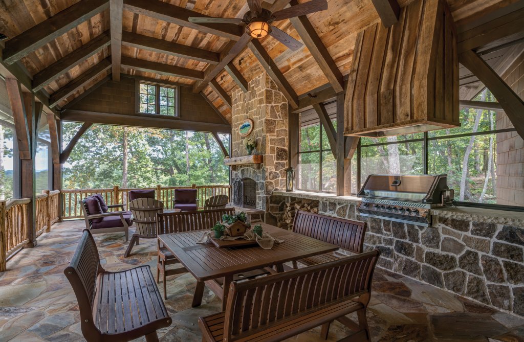 Easy Breezy - A favorite space in the home, the screened porch is an oasis, complete with a fireplace for cool nights and a built-in grill for outdoor entertaining. Accordion doors can tuck away neatly, creating a seamless transition between indoors and out.
