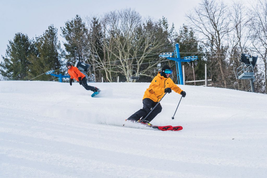 At Cataloochee, a professional ski teacher makes perfect turns above a sea of Smokies clouds. Photo by Leslie Restivio/ VisitNC.com