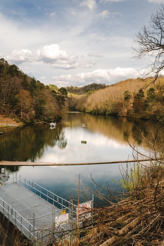 The dam, still water teems with biodiverse aquatic species that used to be able to swim upstream into the Qualla Boundary, but are now cut off .