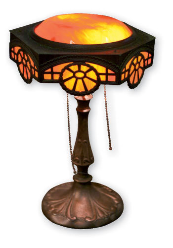 A 1920s arts and crafts-style, slag glass lamp restored by John Fisher, who owns Blue Moon Custom Stained Glass at Architectural Warehouse in Tryon.