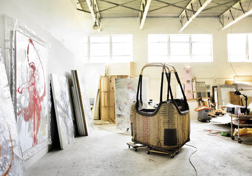 The hot air balloon basket in his studio was a  birthday present, which he will incorporate into an installation.