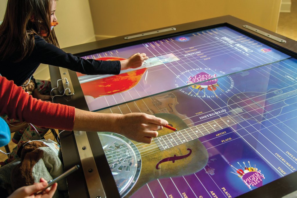 Visitors can examine cultural and musical milestones with an interactive table.