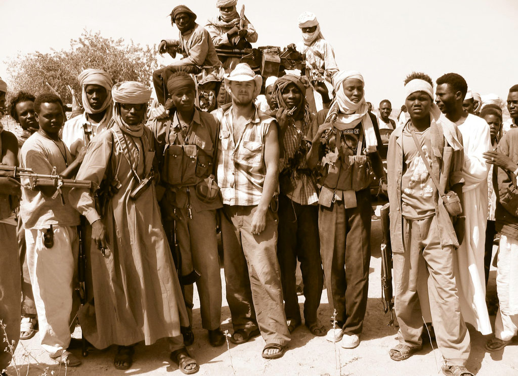 Mission Impossible In 2004 at age 25, Doc Hendley (center) spent a year in the midst of the Darfur Genocide, offering humanitarian aid.