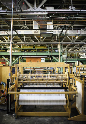 a dobby loom creates cloth that is indistinguishable from hand-woven fabric.