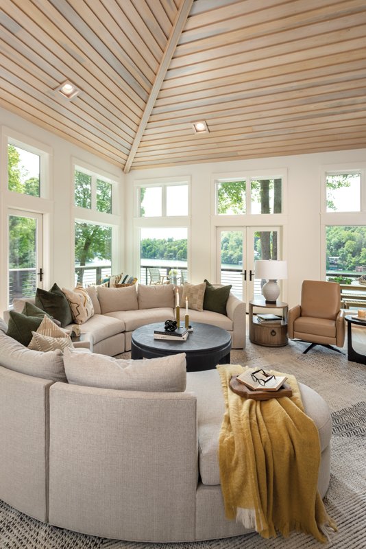 Room with a View - Light-toned wood on the high ceilings set the tone for much of the home’s airy and light interior design.