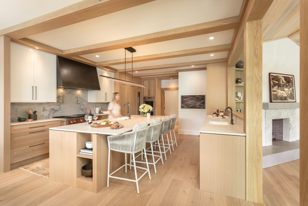 Expanding - Talli Roberts of Allard + Roberts Interior Design, along with architect Eric Daffron and builder Steve Hammett, “showed the family what was possible” within the existing footprint of the house. An open-concept kitchen and dining room provides connection within the home.