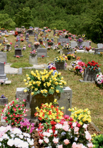 Perennial Event: Flowers grace every grave at Brendle Hill Cemetery in Swain County after a Decoration Day ceremony held in 2007