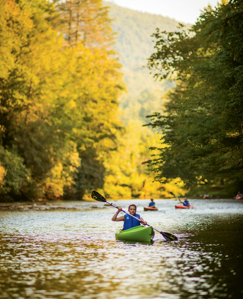 Kayakers take in a tranquil stretch of the river in Transylvania County.